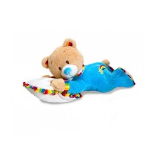 Bébé câlin ours en peluche sur coussin